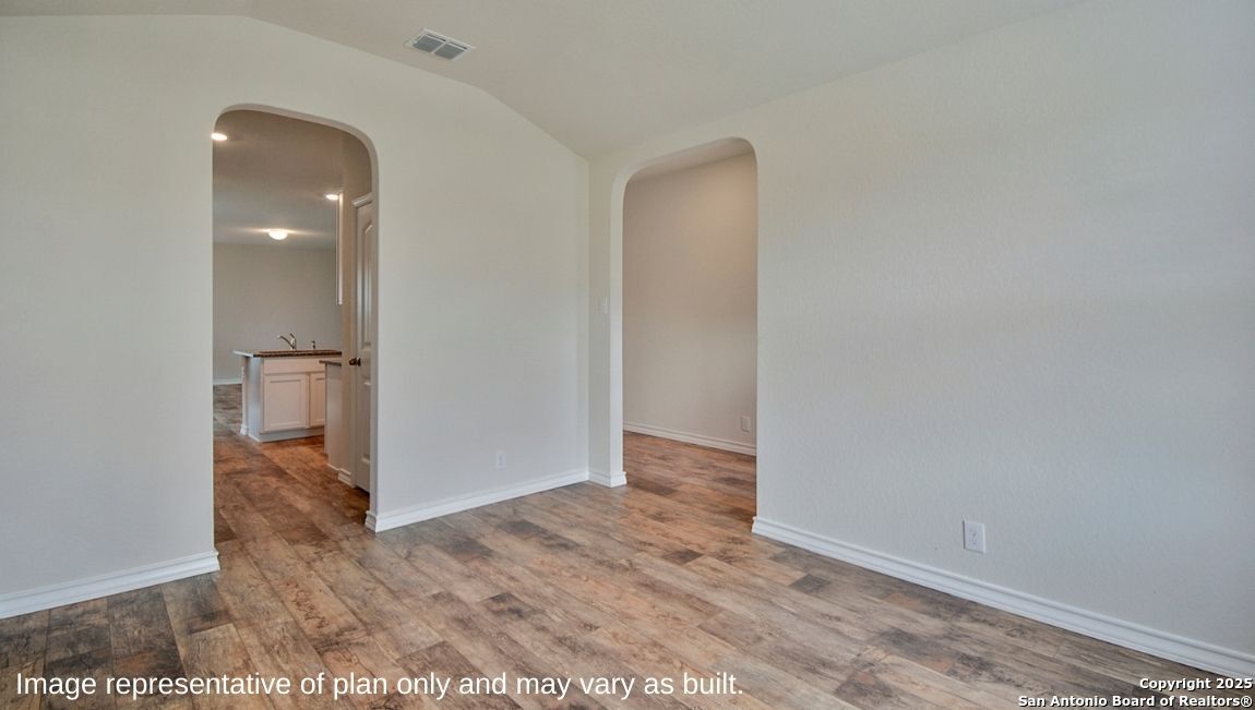 154 Double L Drive Comfort, TX 78620 - Photo 4 of 26 an empty room with wooden floor and entrance