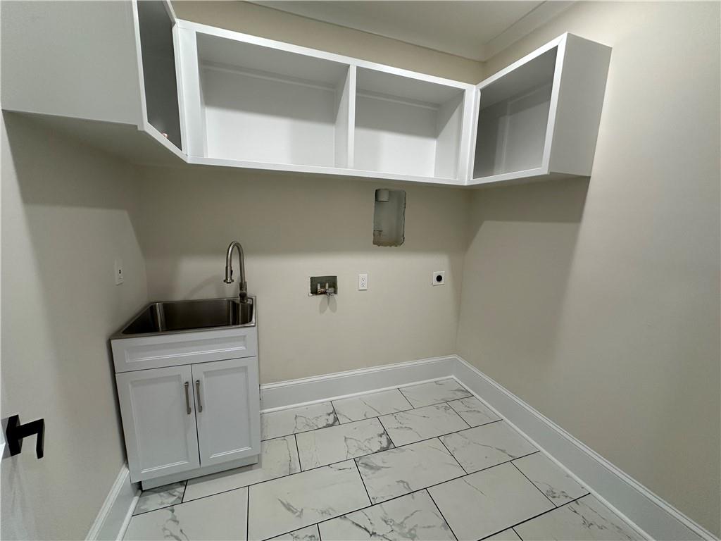 3354 Plainview Road Maysville, GA 30558 - Photo 22 of 50 a room with a cabinets and washer dryer