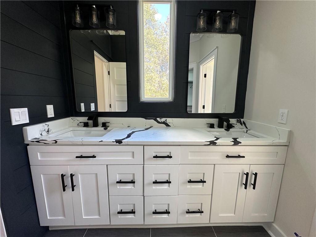 3354 Plainview Road Maysville, GA 30558 - Photo 25 of 50 a bathroom with a sink vanity and mirror