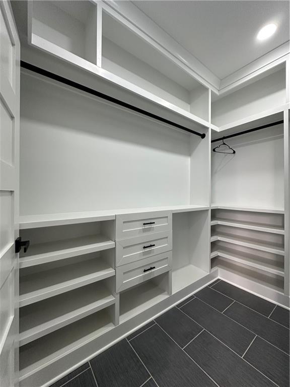 3354 Plainview Road Maysville, GA 30558 - Photo 27 of 50 a view of walk in closet with empty racks