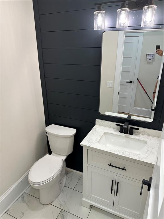 3354 Plainview Road Maysville, GA 30558 - Photo 31 of 50 a bathroom with a toilet sink and mirror