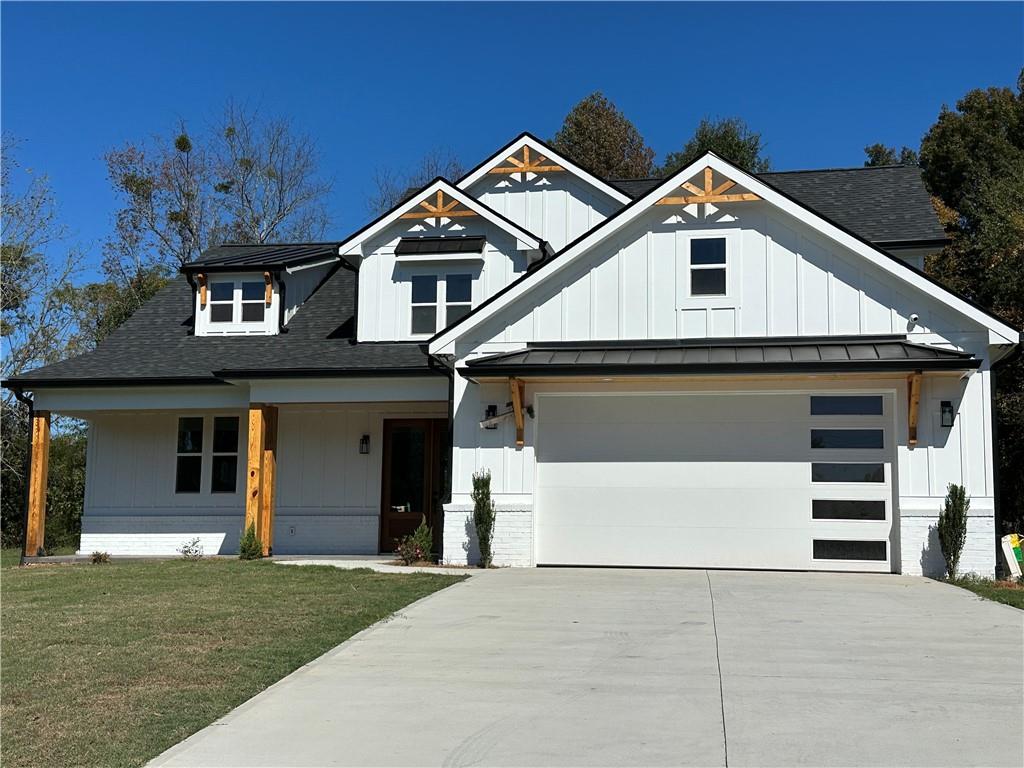 3354 Plainview Road Maysville, GA 30558 - Photo 39 of 50 a front view of a house with a yard and garage