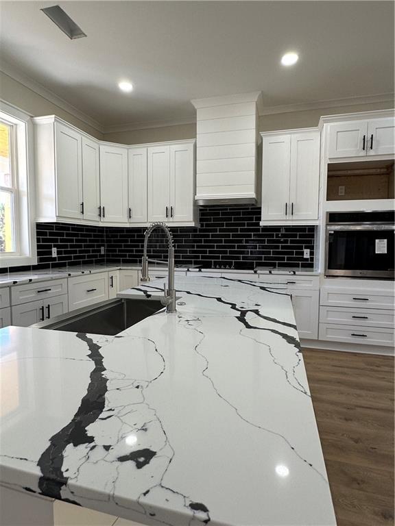 3354 Plainview Road Maysville, GA 30558 - Photo 47 of 50 a kitchen with stainless steel appliances kitchen island granite countertop a sink a stove and cabinets