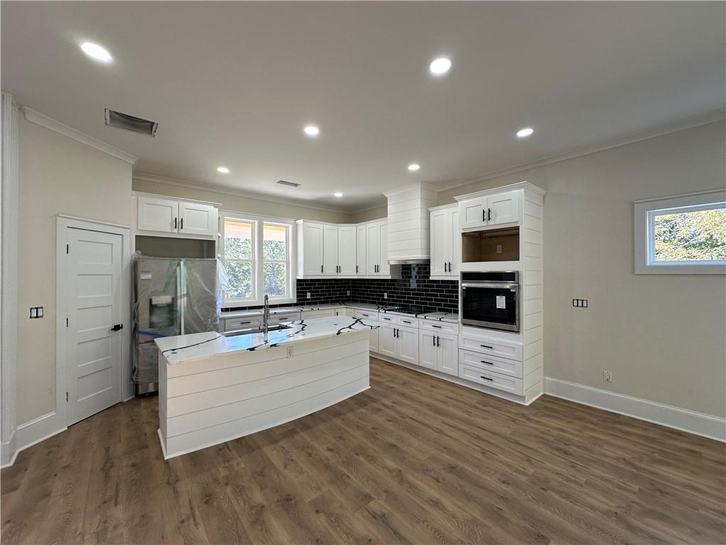 3354 Plainview Road Maysville, GA 30558 - Photo 50 of 50 a large kitchen with stainless steel appliances kitchen island granite countertop a refrigerator and a stove top oven