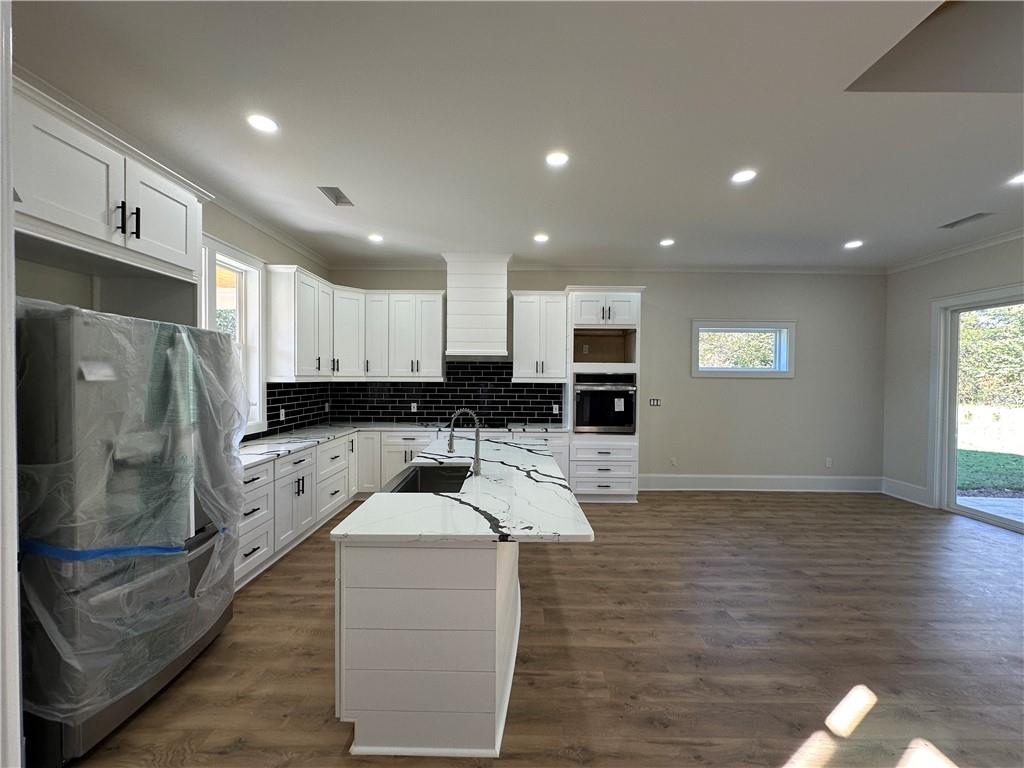 3354 Plainview Road Maysville, GA 30558 - Photo 7 of 50 a kitchen with stainless steel appliances kitchen island granite countertop a refrigerator and a sink