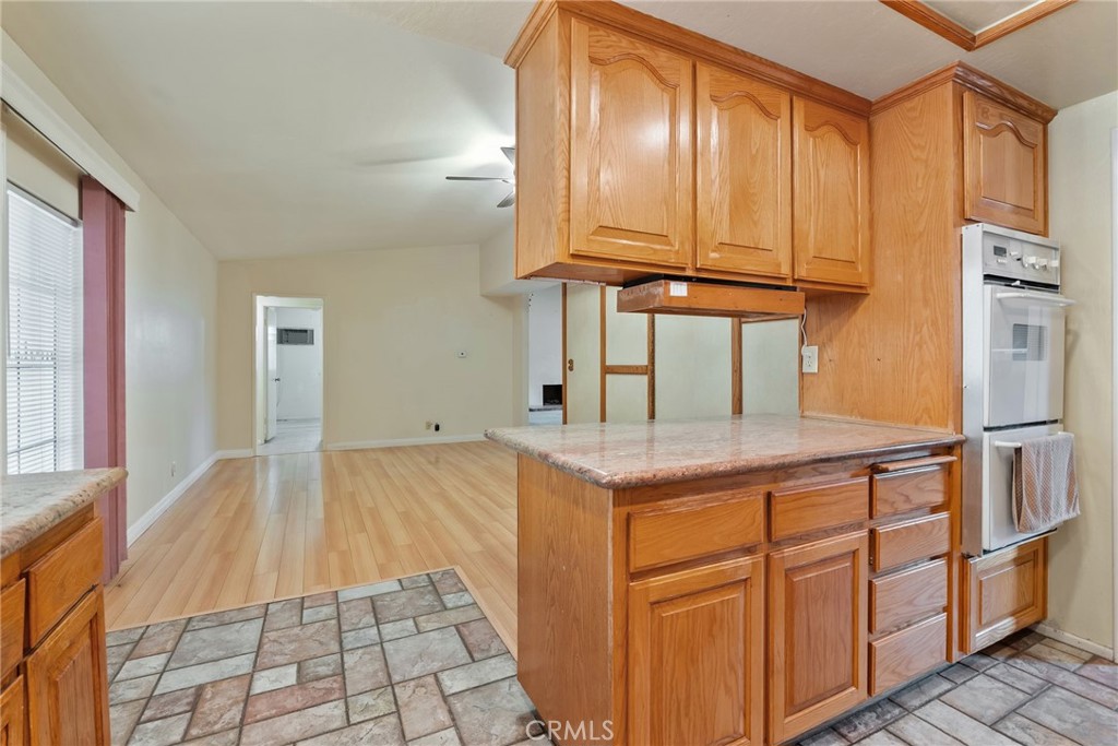 5385 Strasbourg Avenue Irvine, CA 92604 - Photo 17 of 59 a kitchen with stainless steel appliances granite countertop a sink refrigerator and cabinets