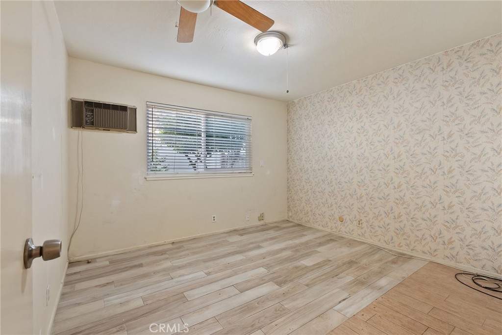 5385 Strasbourg Avenue Irvine, CA 92604 - Photo 23 of 59 an empty room with wooden floor and windows