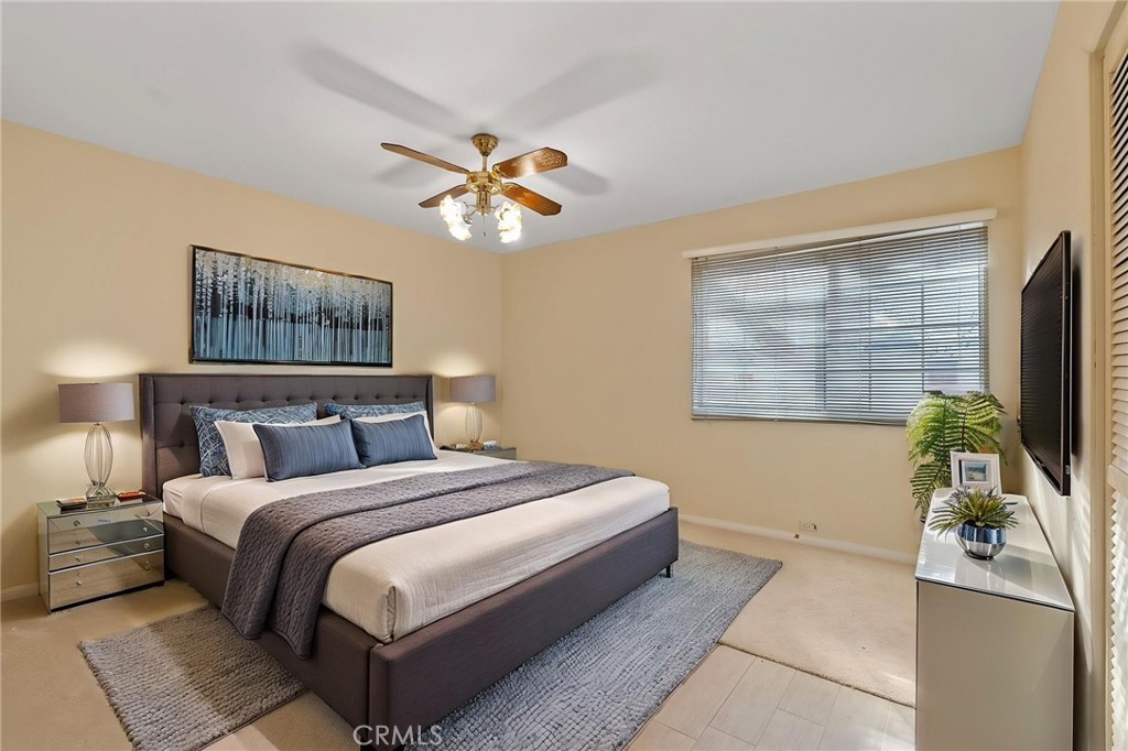 5385 Strasbourg Avenue Irvine, CA 92604 - Photo 30 of 59 a bedroom with a bed and a chandelier