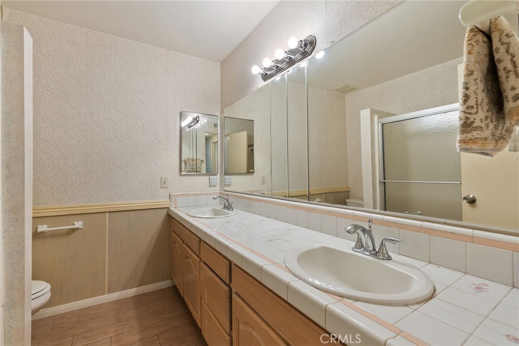 5385 Strasbourg Avenue Irvine, CA 92604 - Photo 32 of 59 a bathroom with a sink double vanity and a mirror