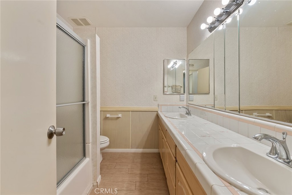 5385 Strasbourg Avenue Irvine, CA 92604 - Photo 33 of 59 a bathroom with a granite countertop sink mirror and a bathtub