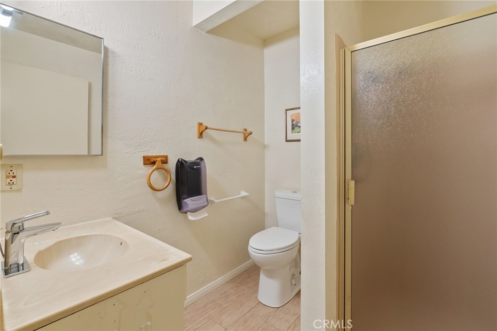 5385 Strasbourg Avenue Irvine, CA 92604 - Photo 35 of 59 a bathroom with a sink toilet and vanity