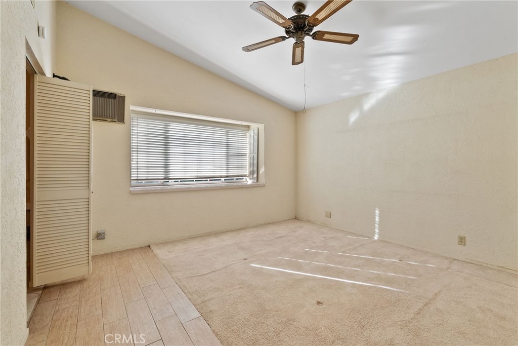 5385 Strasbourg Avenue Irvine, CA 92604 - Photo 36 of 59 a view of an empty room with a window and a ceiling fan