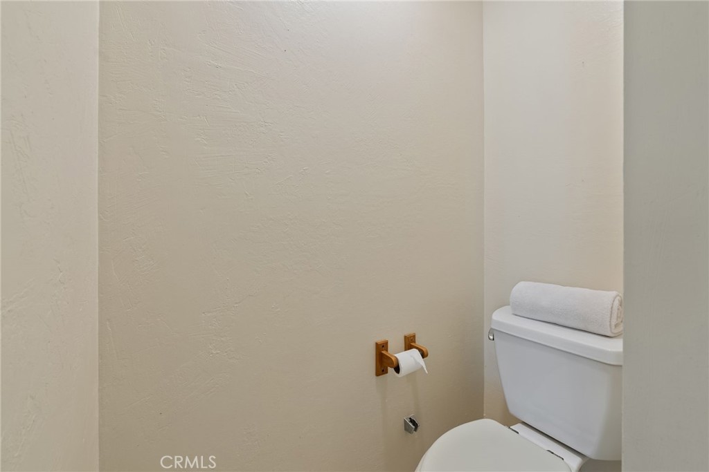 5385 Strasbourg Avenue Irvine, CA 92604 - Photo 42 of 59 a white toilet sitting next to a white wall