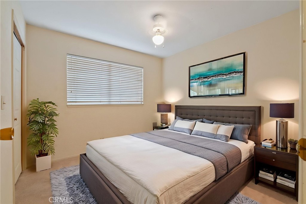 5385 Strasbourg Avenue Irvine, CA 92604 - Photo 44 of 59 a bedroom with bed and a potted plant