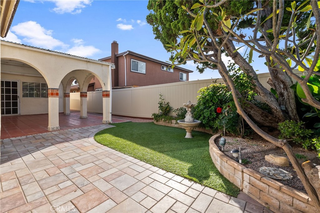 5385 Strasbourg Avenue Irvine, CA 92604 - Photo 50 of 59 a front view of a house with garden