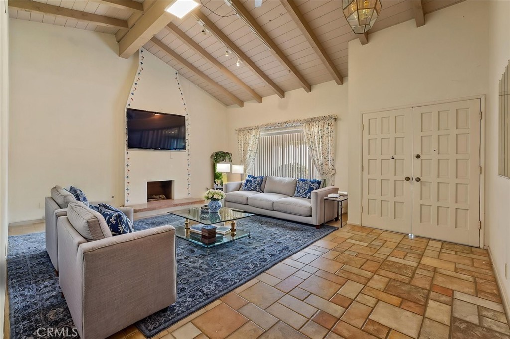 5385 Strasbourg Avenue Irvine, CA 92604 - Photo 6 of 59 a living room with furniture and a fireplace