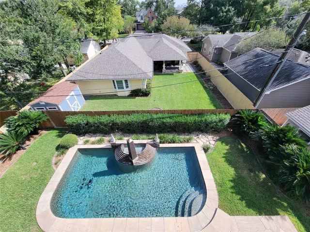 a view of a room with window and ceiling fan