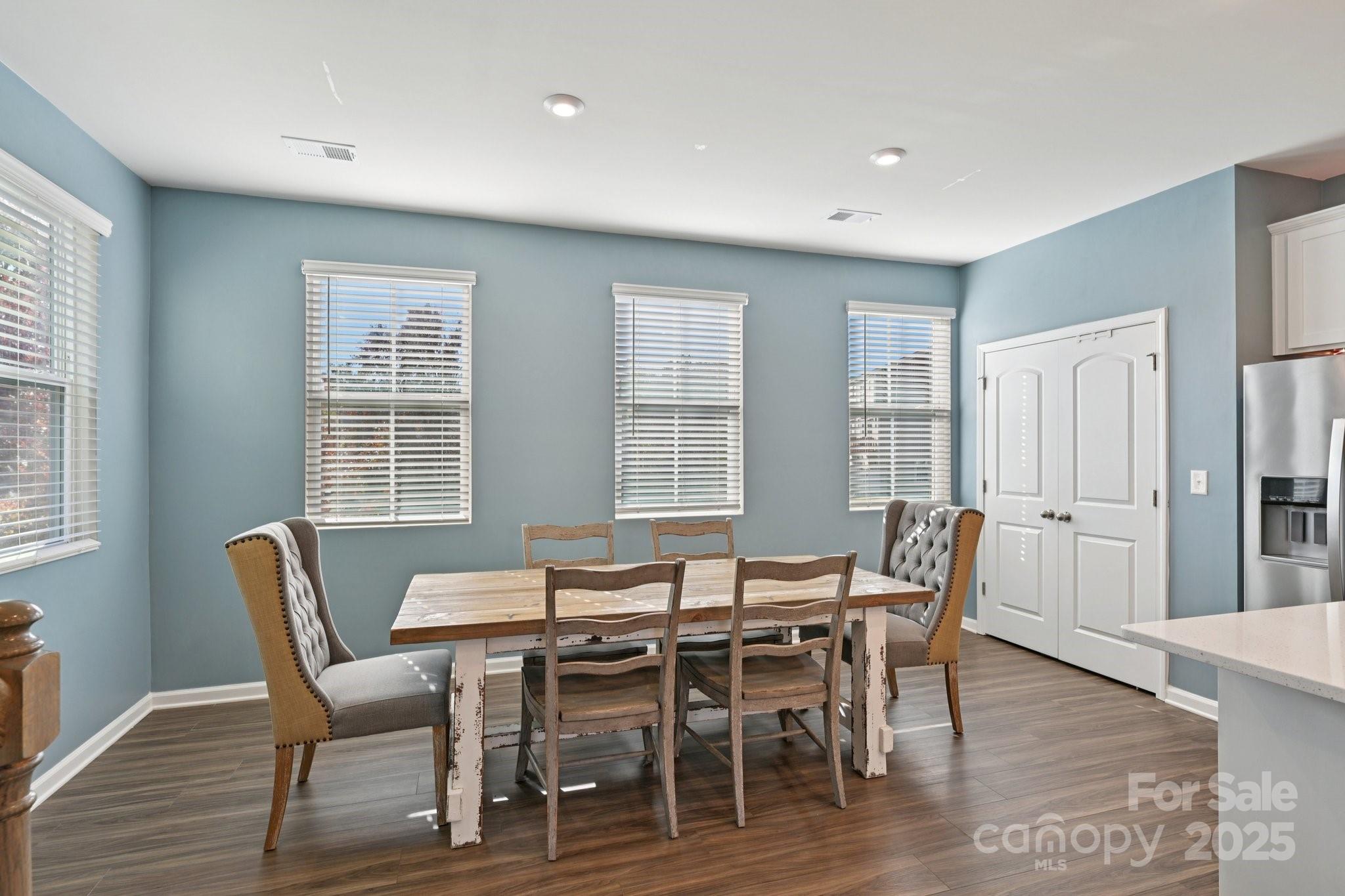 2932 Pirates Place Charlotte, NC 28216 - Photo 11 of 32 a view of a dining room with furniture and wooden floor
