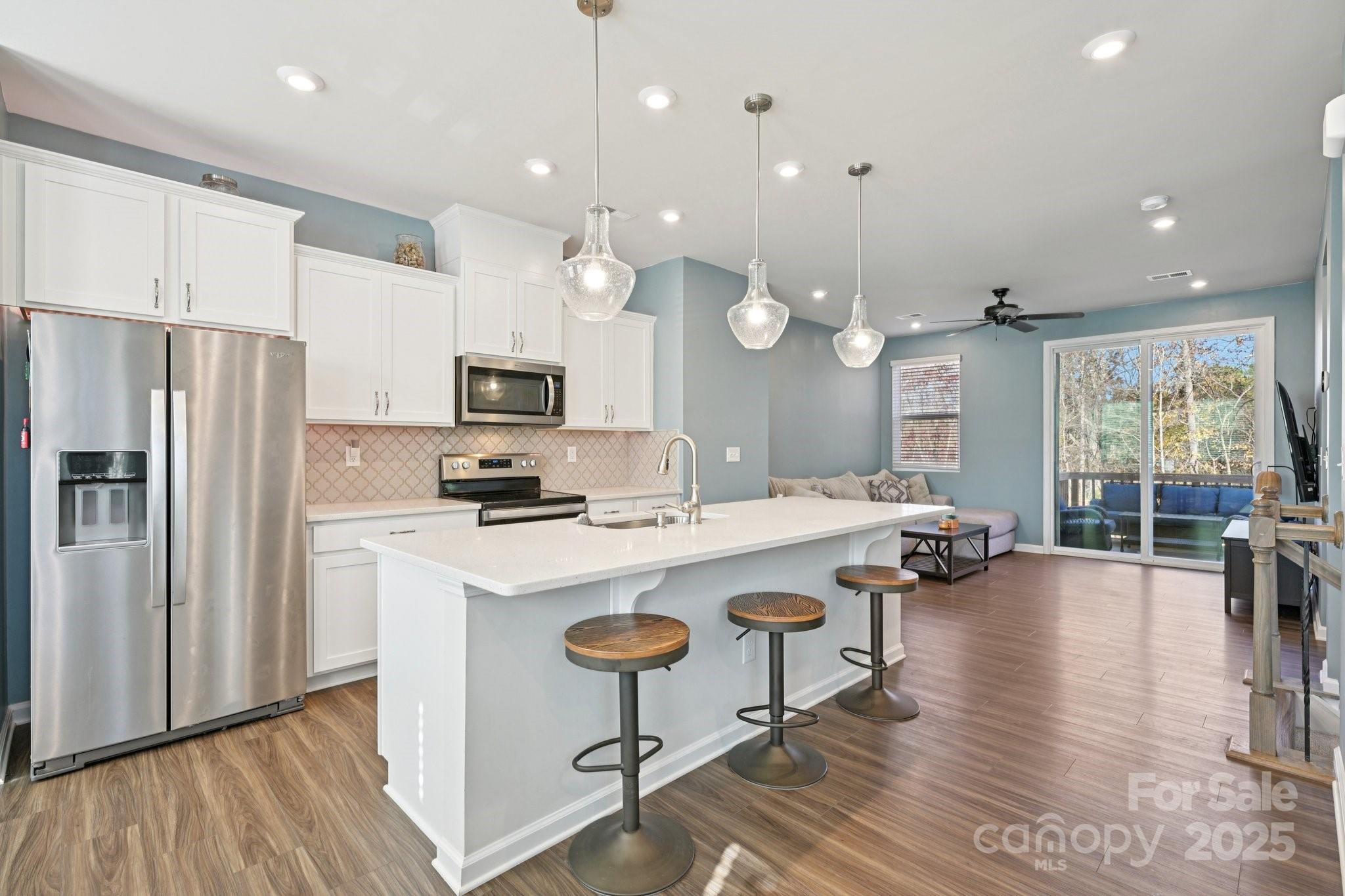 2932 Pirates Place Charlotte, NC 28216 - Photo 13 of 32 a kitchen with sink stove and refrigerator