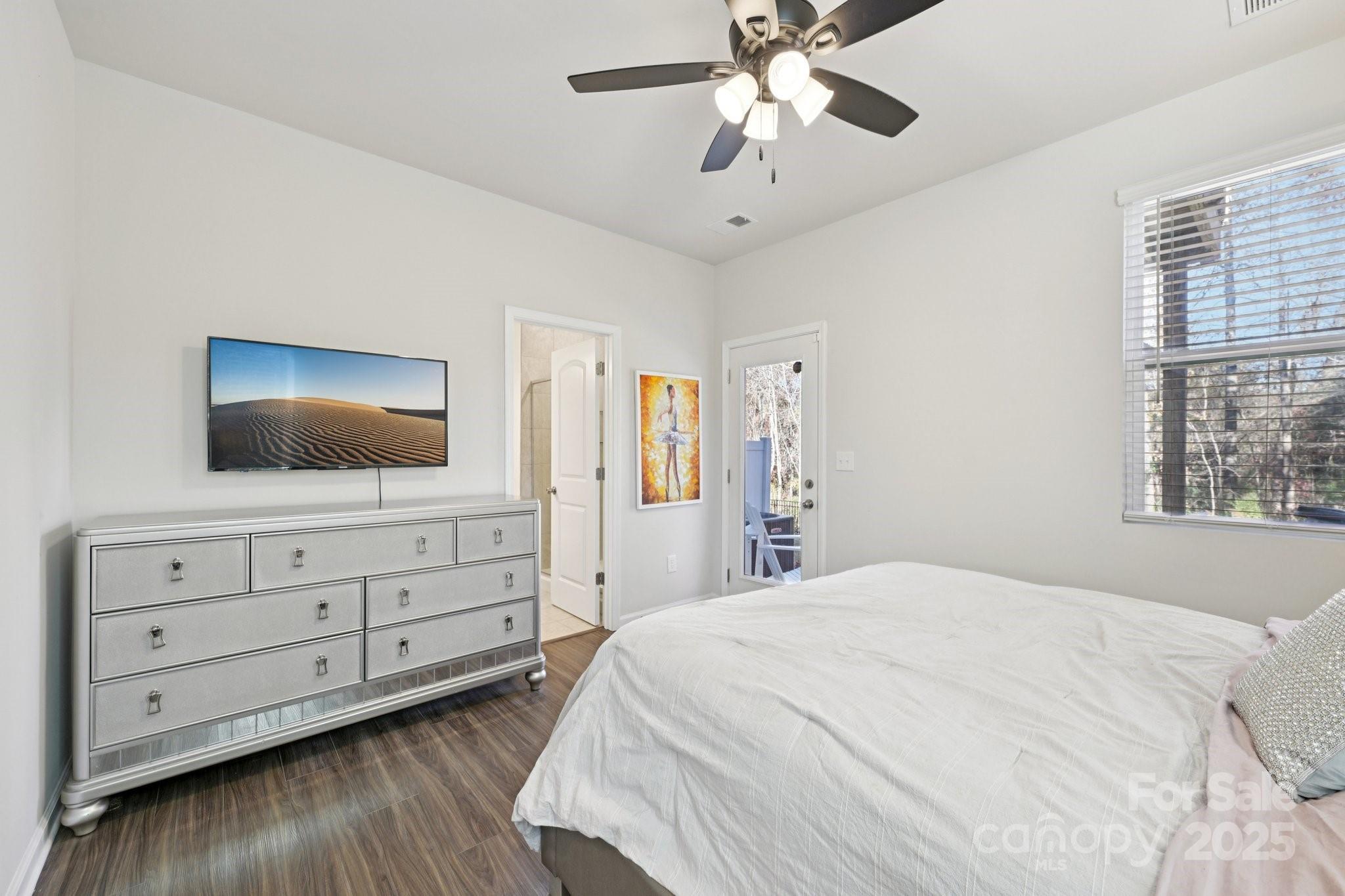 2932 Pirates Place Charlotte, NC 28216 - Photo 17 of 32 a bedroom with a bed and a flat screen tv