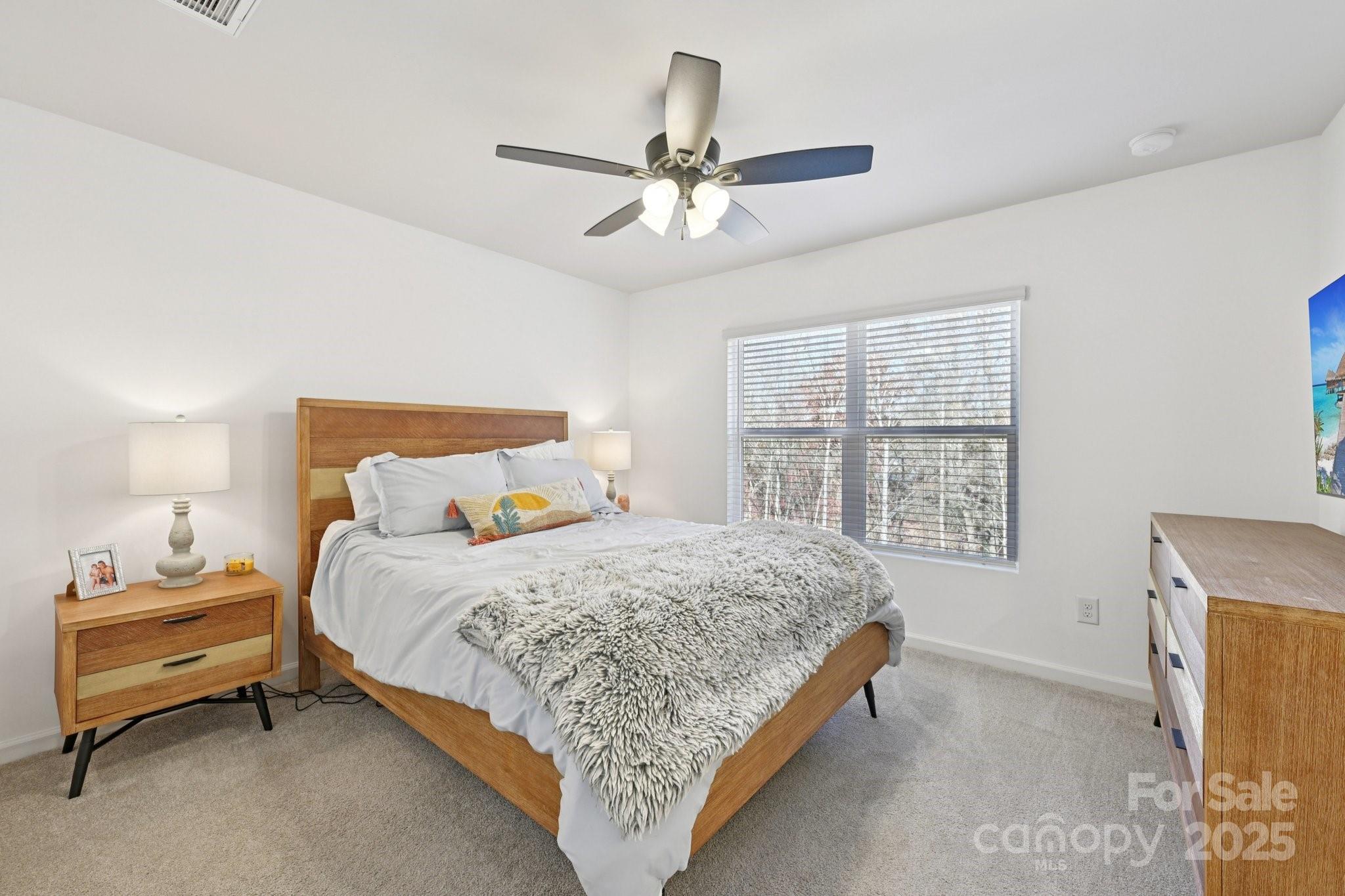 2932 Pirates Place Charlotte, NC 28216 - Photo 21 of 32 a bedroom with a bed and a window