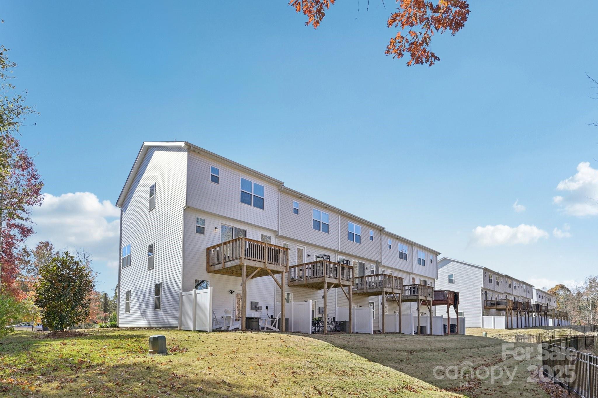2932 Pirates Place Charlotte, NC 28216 - Photo 32 of 32 a front view of a building with a big yard