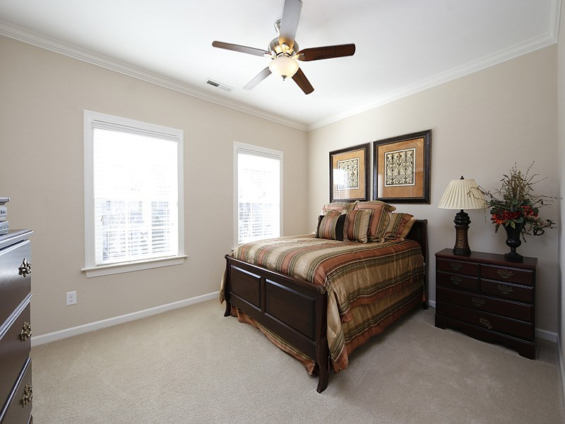 1145 Chapanoke Road Raleigh, NC 27603 - Photo 20 of 25 One of the upstairs bedrooms. They are both large and have fans, walk-in closets and crown molding. Bedroom