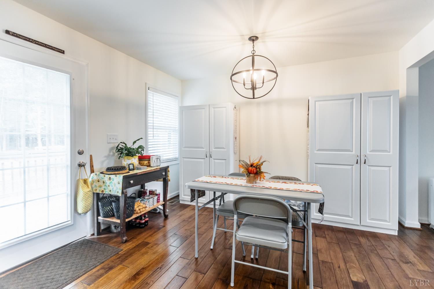 7099 Oakville Road Appomattox, VA 24522 - Photo 12 of 31 a view of a dining room with furniture window and wooden floor