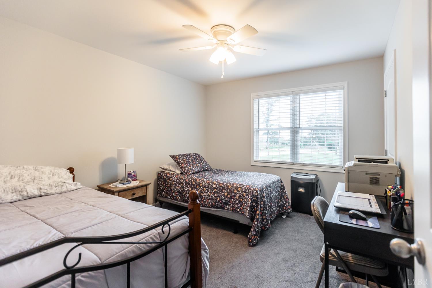 7099 Oakville Road Appomattox, VA 24522 - Photo 16 of 31 a bedroom with two beds and a table