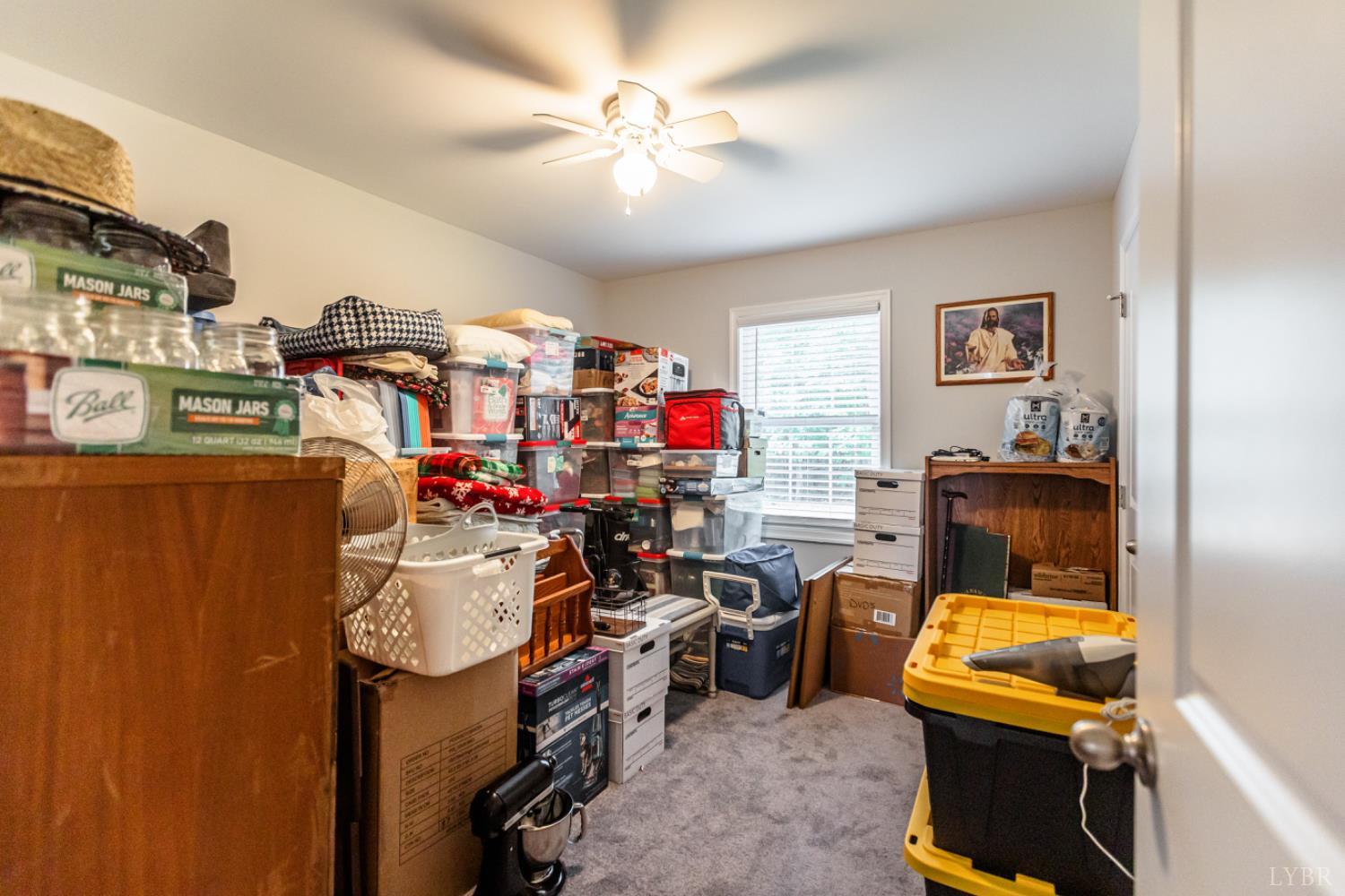 7099 Oakville Road Appomattox, VA 24522 - Photo 17 of 31 a view of a workspace with furniture and a window