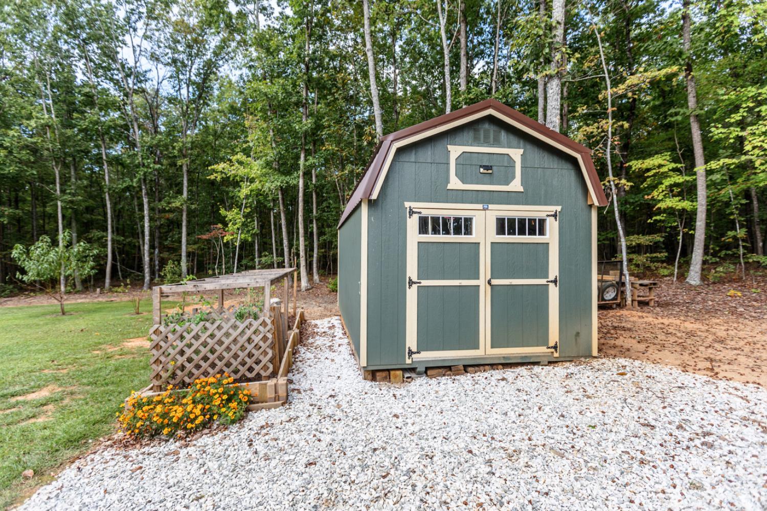 7099 Oakville Road Appomattox, VA 24522 - Photo 25 of 31 a front view of a house with garden
