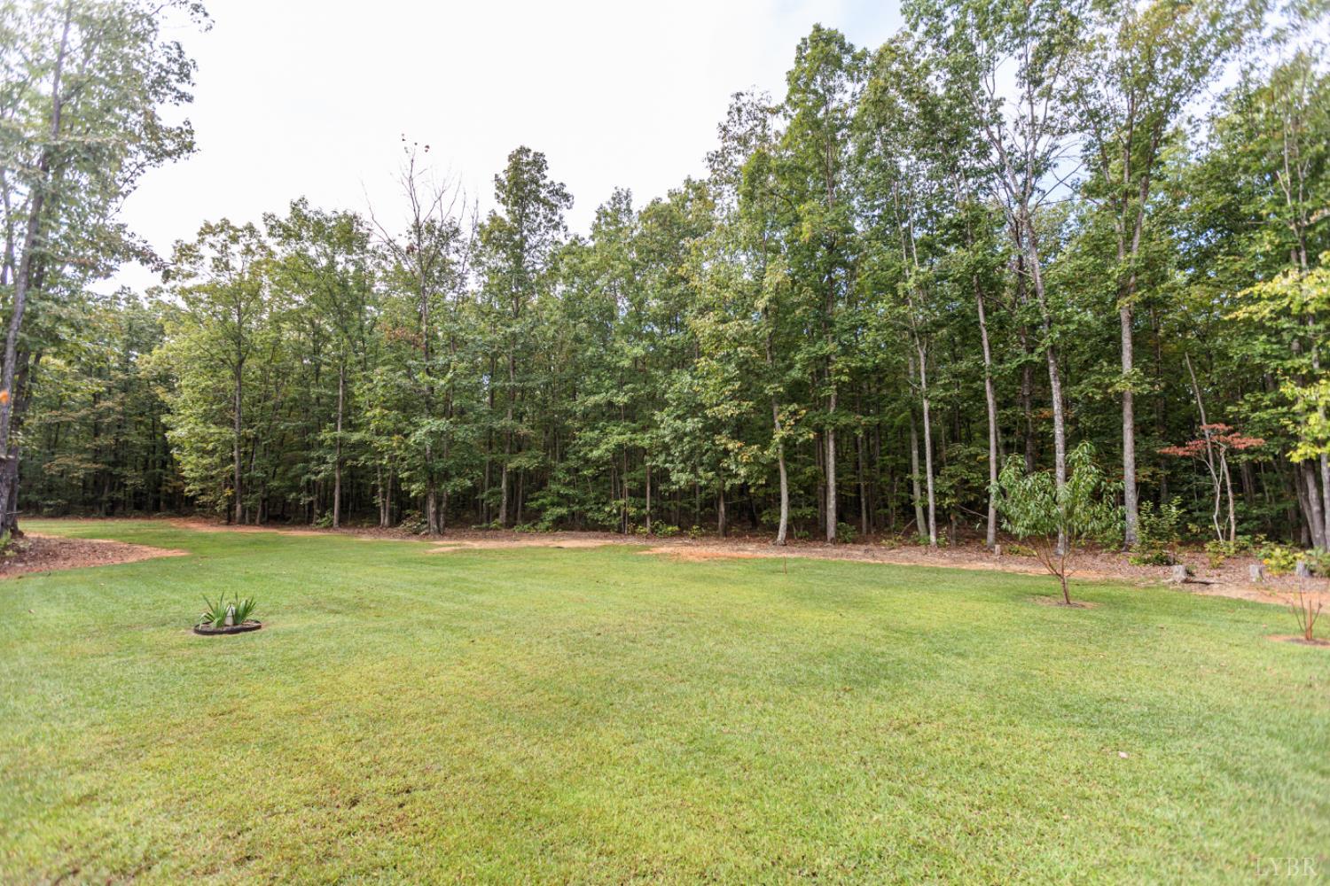 7099 Oakville Road Appomattox, VA 24522 - Photo 26 of 31 a view of outdoor space with deck and yard