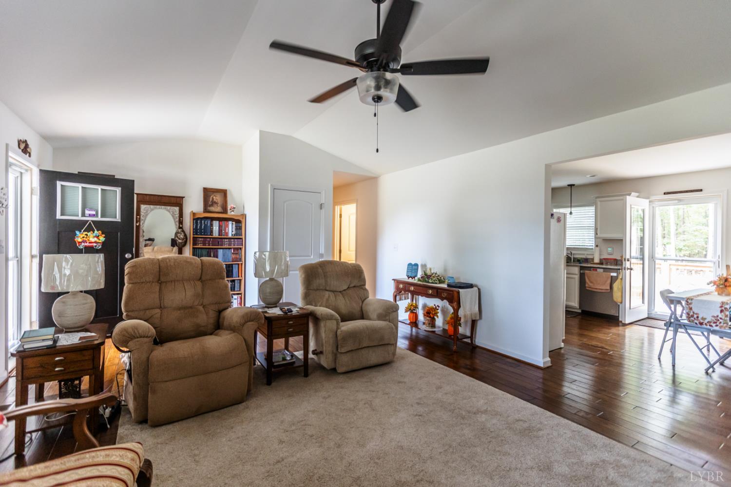 7099 Oakville Road Appomattox, VA 24522 - Photo 7 of 31 a living room with furniture and a flat screen tv