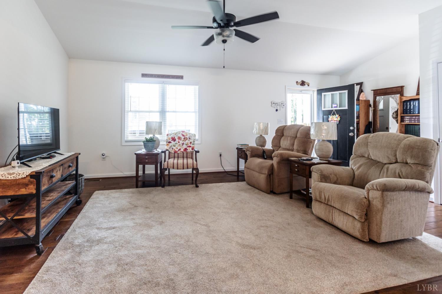 7099 Oakville Road Appomattox, VA 24522 - Photo 8 of 31 a living room with furniture and a flat screen tv