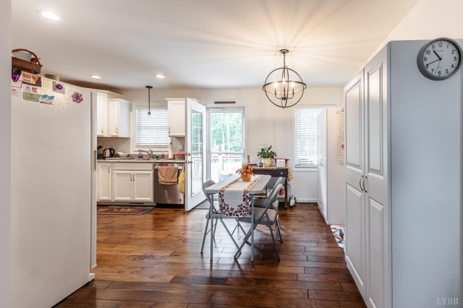 7099 Oakville Road Appomattox, VA 24522 - Photo 9 of 31 a view of a kitchen with dining table and chairs