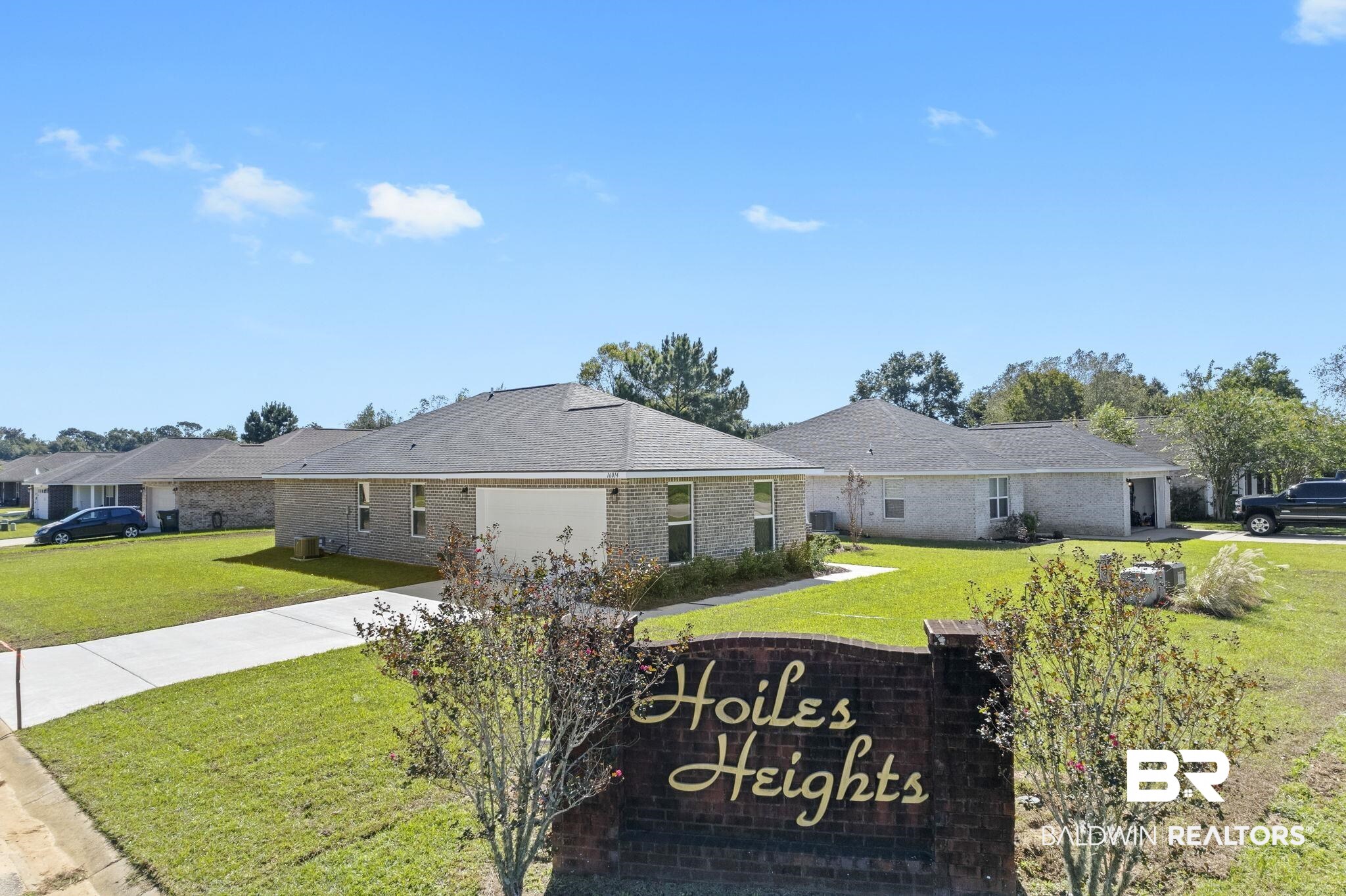 16014 Alabama Avenue Silverhill, AL 36576 - Photo 2 of 50 Single story home featuring a garage and a front lawn