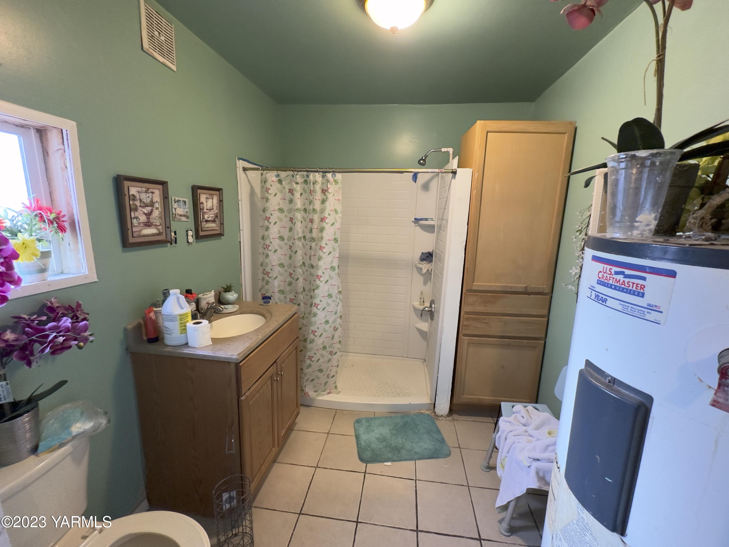 450 Main Street Parker, WA 98939 - Photo 18 of 18 a bathroom with a refrigerator and a shower