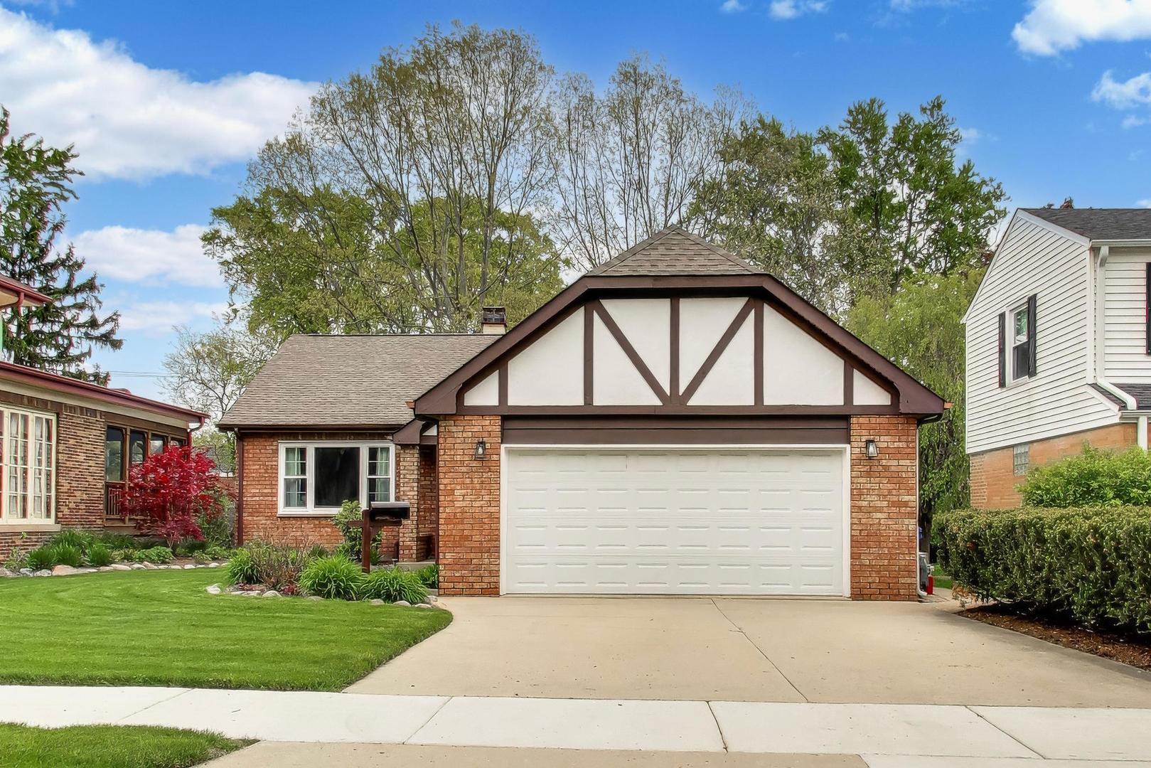 313 South Hi Lusi Avenue Mount Prospect, IL 60056 - Photo 2 of 40 a front view of a house with garden
