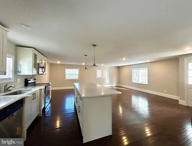 a view of a kitchen and dining room
