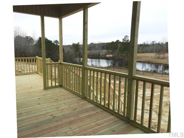 100 North Sunset Ridge Drive, Unit JADE2 Willow Spring, NC 27592 - Photo 4 of 6 a view of balcony with furniture
