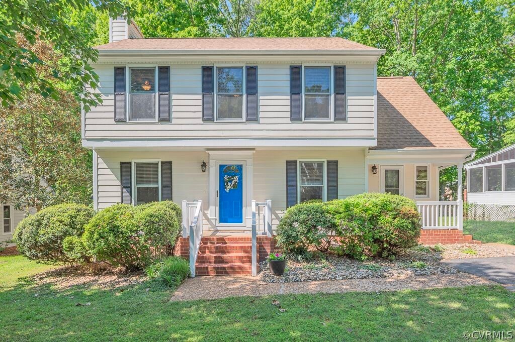 front view of house that has a small yard