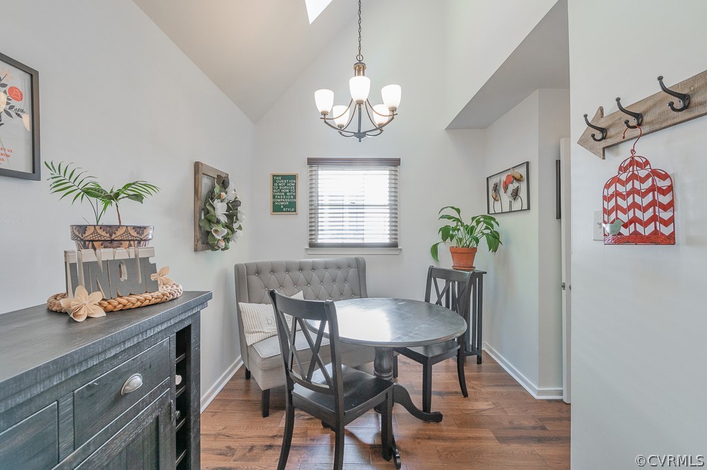 5906 Acorn Ridge Court Midlothian, VA 23112 - Photo 11 of 48 a dining room with furniture a rug and wooden floor
