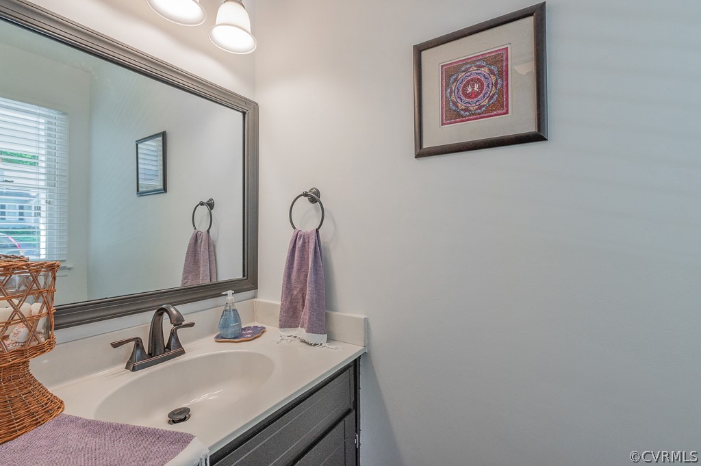 5906 Acorn Ridge Court Midlothian, VA 23112 - Photo 12 of 48 a bathroom with a sink and a mirror