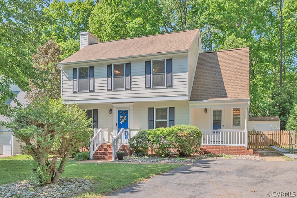 5906 Acorn Ridge Court Midlothian, VA 23112 - Photo 2 of 48 a front view of a house with a yard and garage