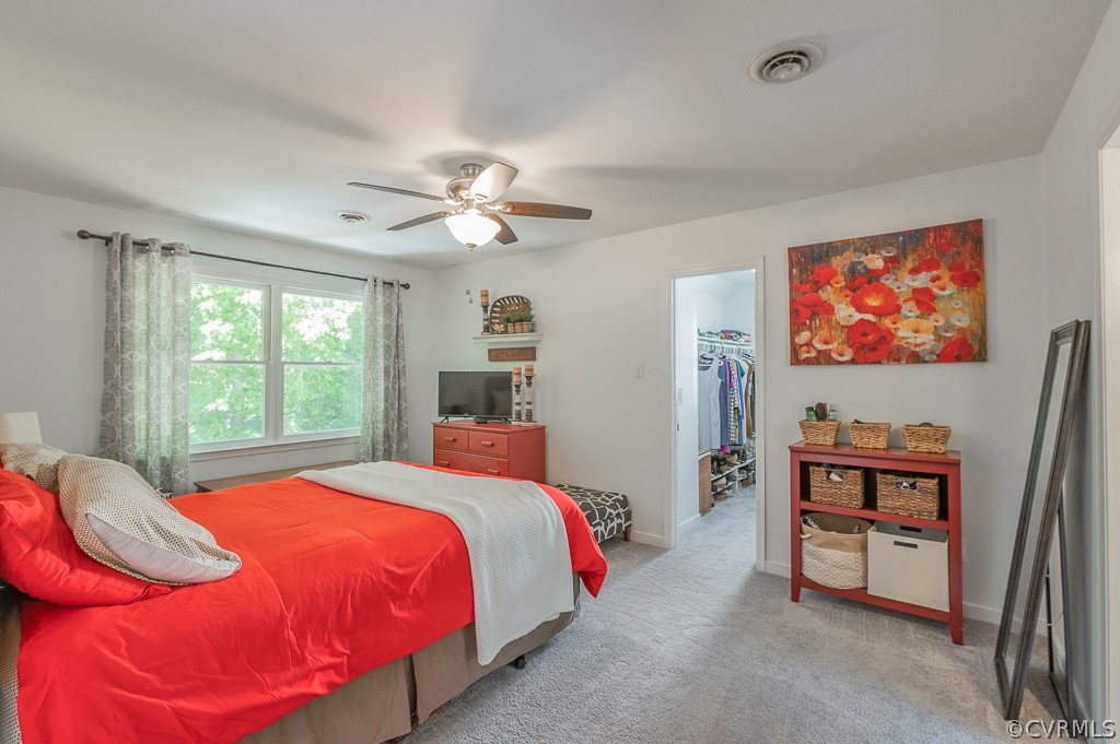 5906 Acorn Ridge Court Midlothian, VA 23112 - Photo 22 of 48 a bedroom with a bed and a chandelier
