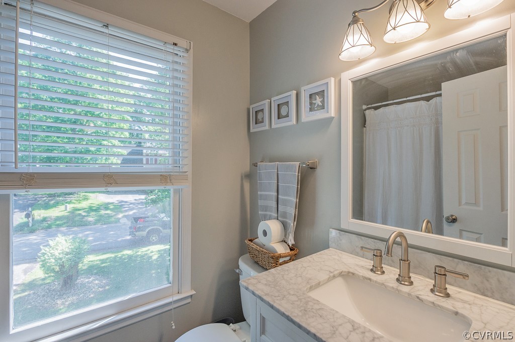 5906 Acorn Ridge Court Midlothian, VA 23112 - Photo 25 of 48 a bathroom with a granite countertop sink and a large mirror