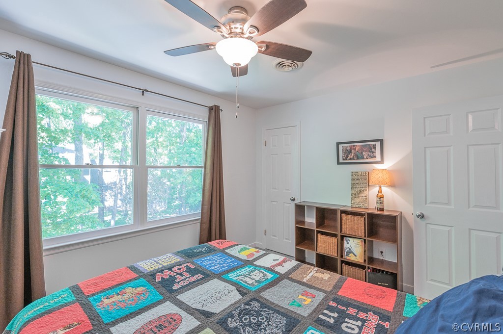 5906 Acorn Ridge Court Midlothian, VA 23112 - Photo 27 of 48 a bedroom with a bed furniture and a window