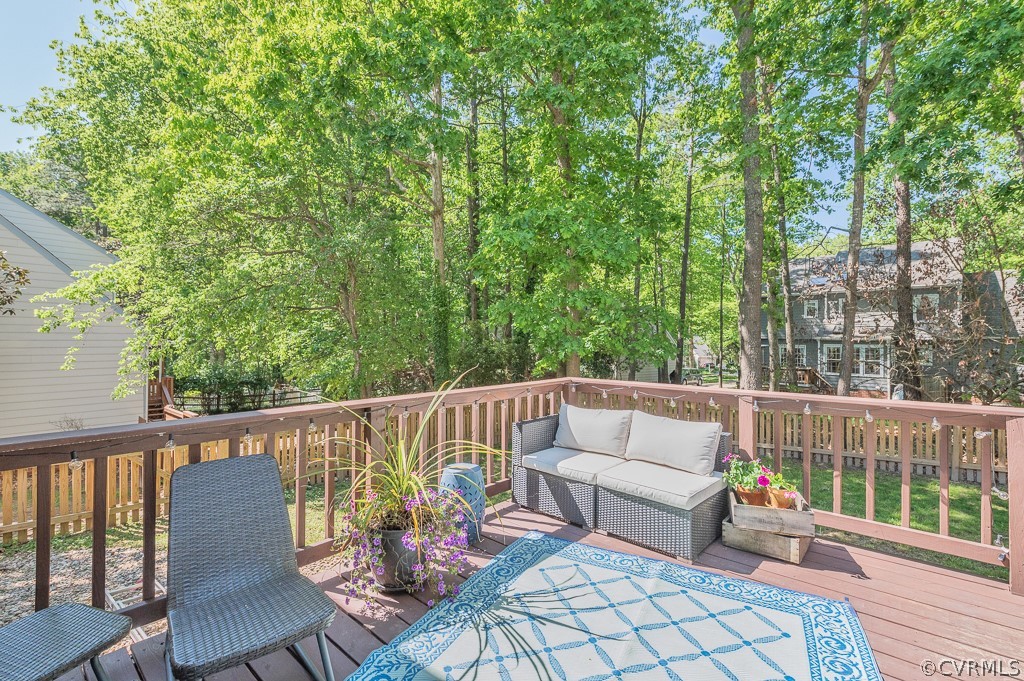 5906 Acorn Ridge Court Midlothian, VA 23112 - Photo 33 of 48 a roof deck with couches and wooden fence