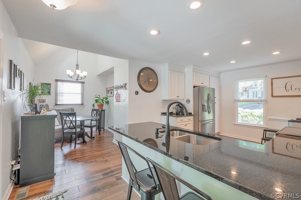 5906 Acorn Ridge Court Midlothian, VA 23112 - Photo 5 of 48 a kitchen with a table chairs sink and cabinets