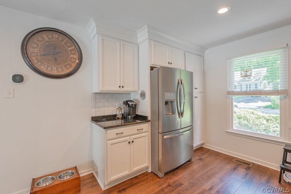 5906 Acorn Ridge Court Midlothian, VA 23112 - Photo 9 of 48 a kitchen with stainless steel appliances granite countertop a refrigerator a stove a sink and a window with wooden floor